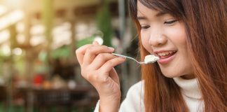 girl eating yoghurt - probiotics